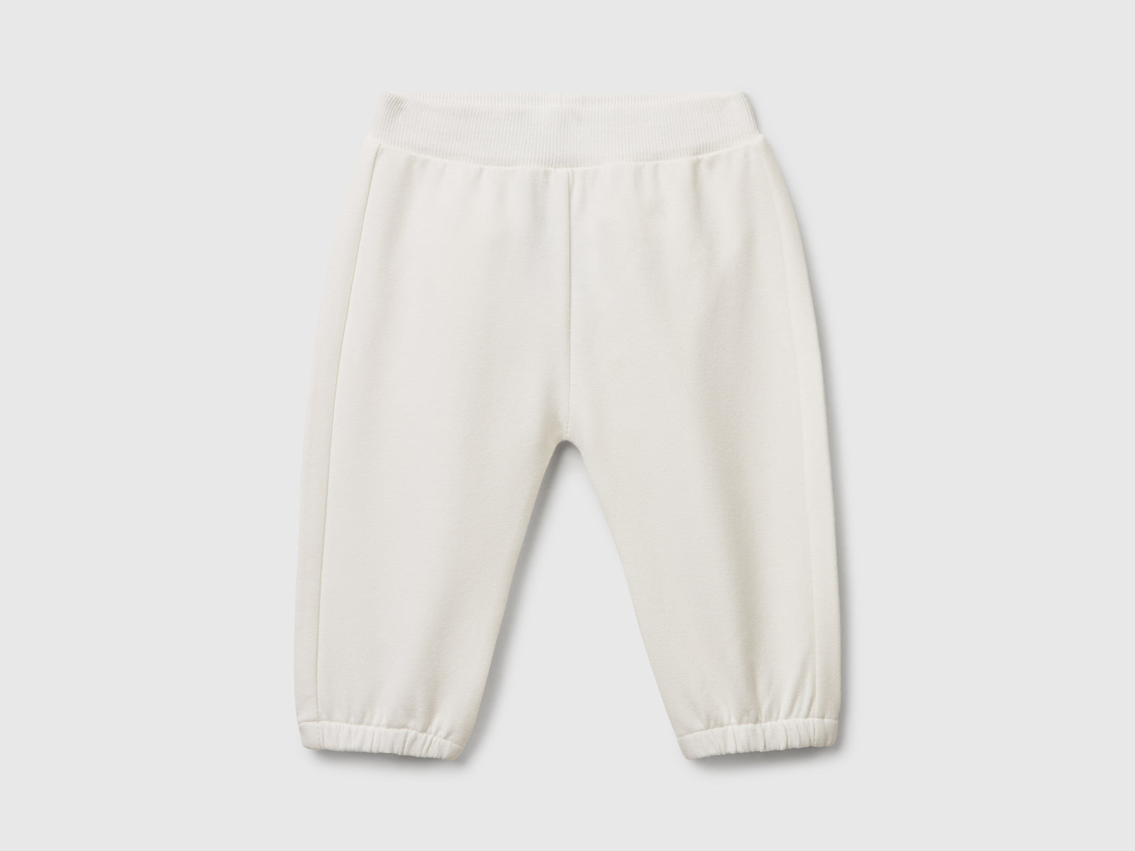 Pantaloni in felpa di cotone da neonato bianco panna | Benetton Outlet