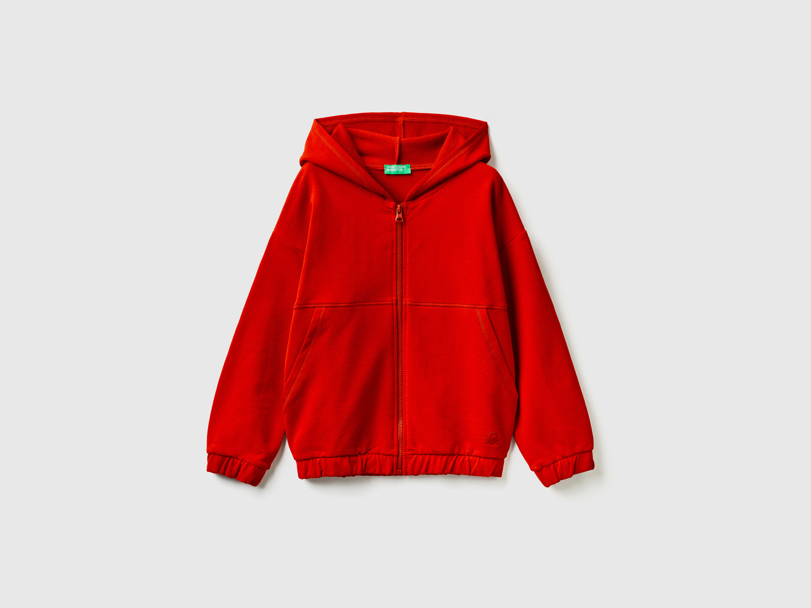 Calda felpa con zip e ricamo logo da bambina rosso | Benetton Outlet