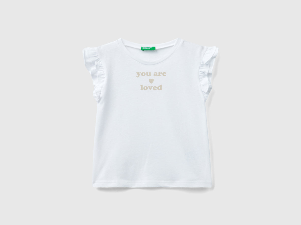 T-shirt con rouches e stampa