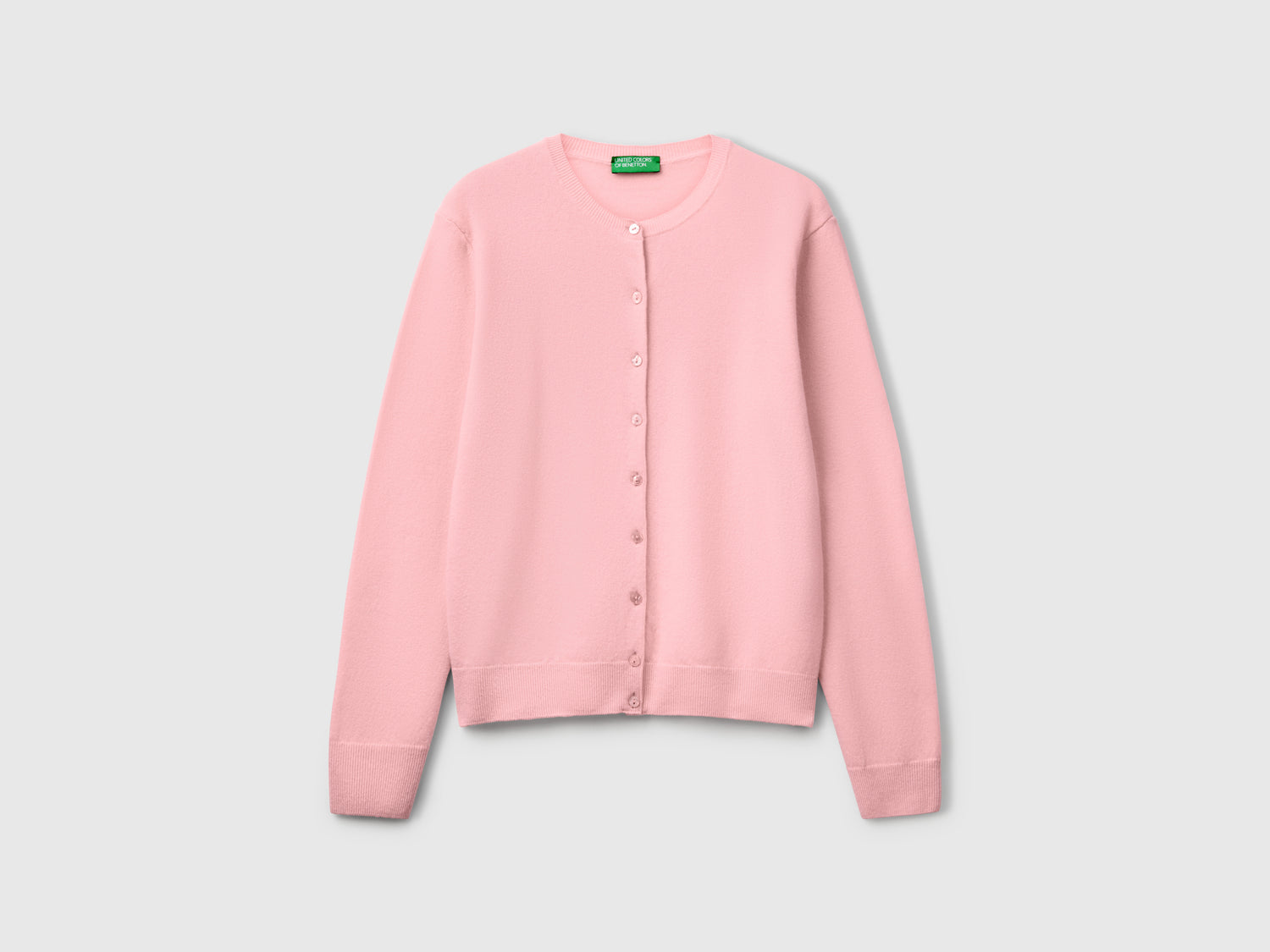 Cardigan girocollo rosa cipria in pura lana Merino da donna rosa tenue | Benetton Outlet