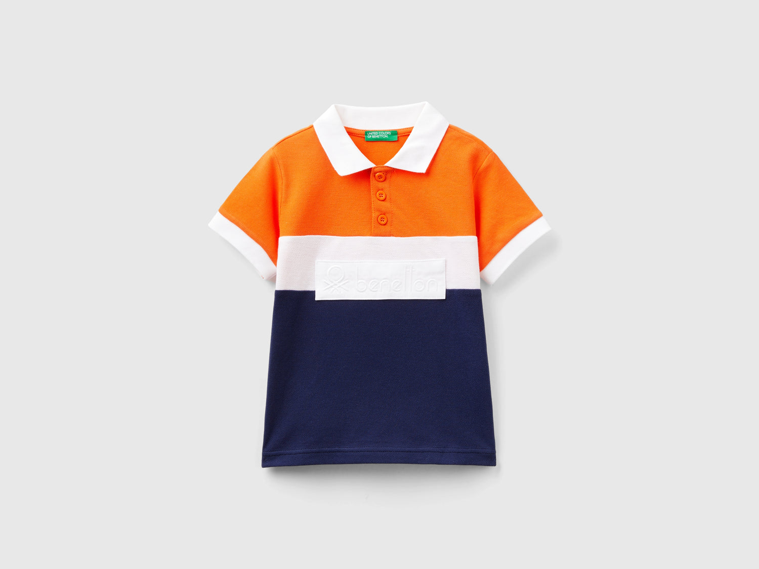 Polo color block con patch da bimbo arancione | Benetton Outlet