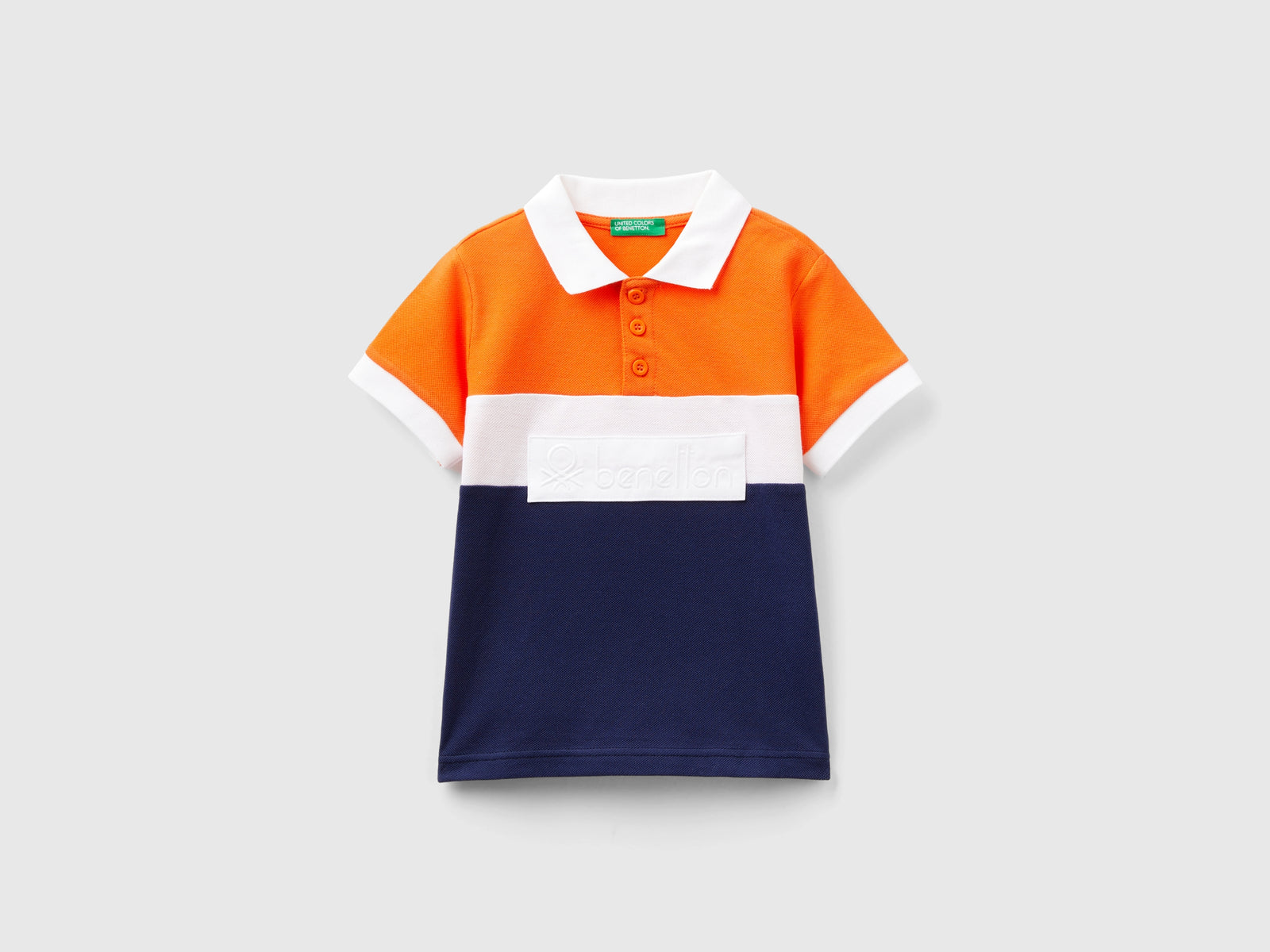 Polo color block con patch da bimbo arancione | Benetton Outlet