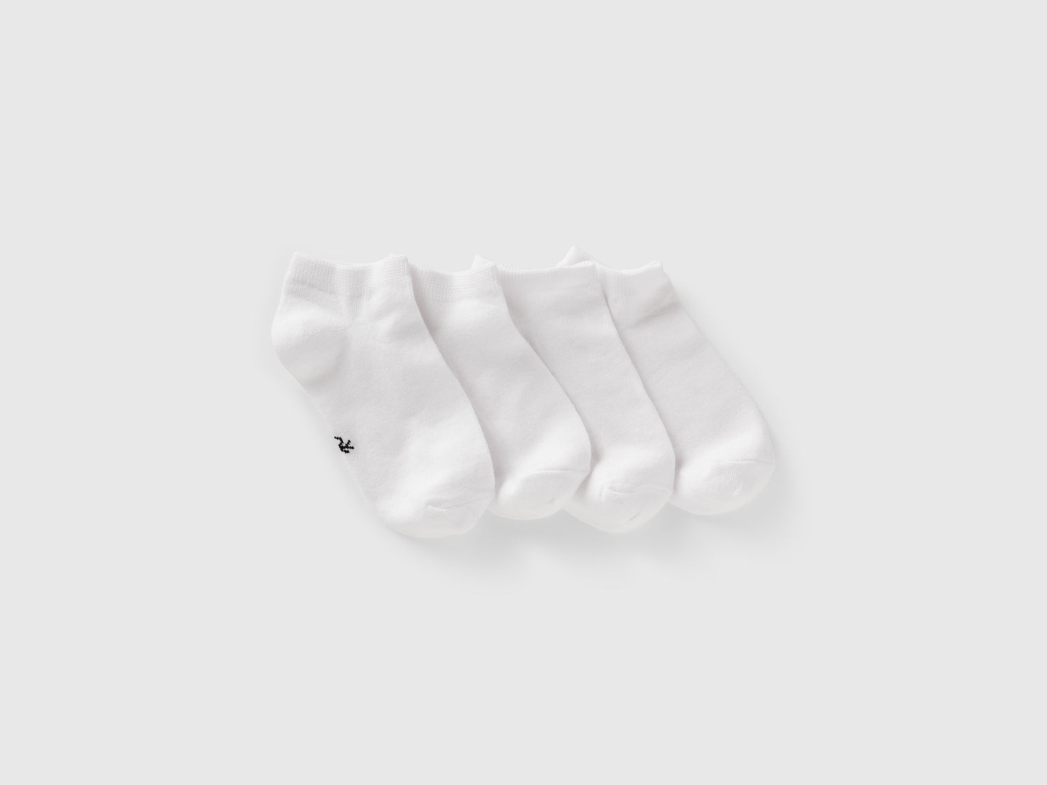 Quattro paia di calzini corti da bambino bianco | Benetton Outlet