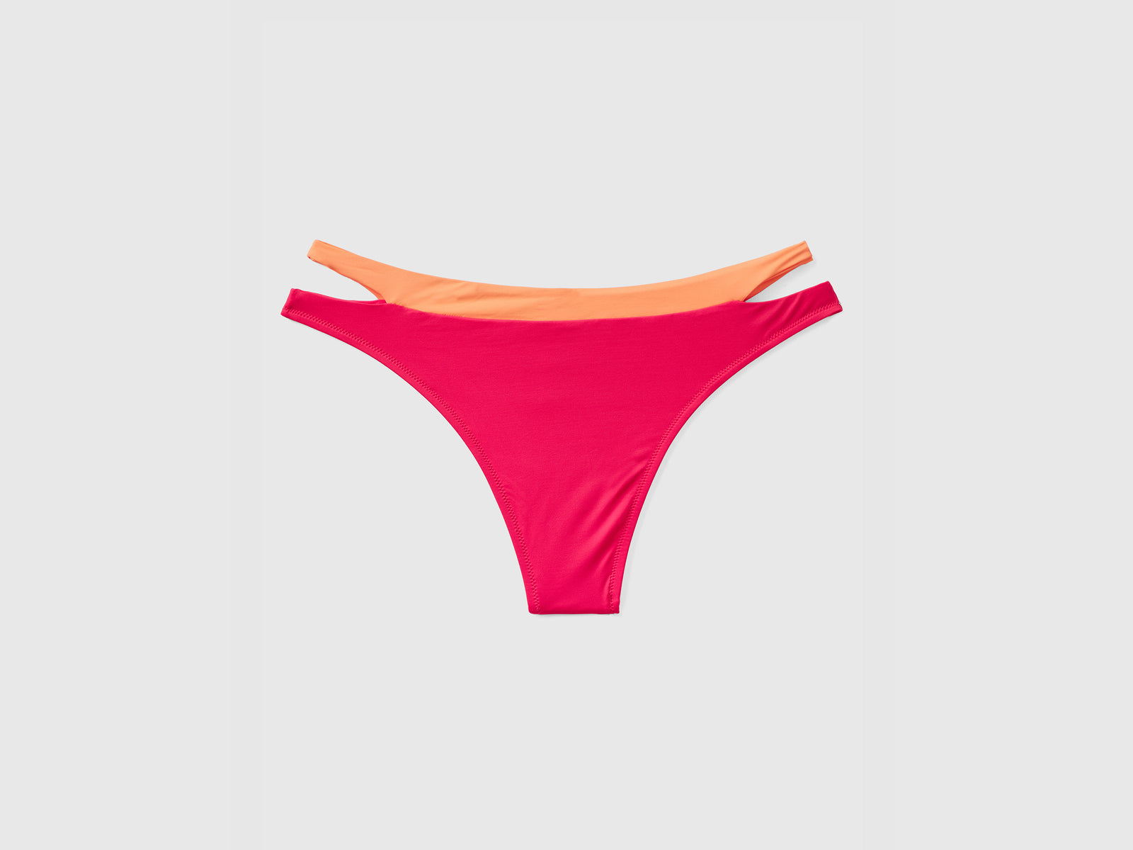 Slip mare bicolor elasticizzati con apertura ad oblò sui fianchi da donna fucsia 2 | Benetton Outlet