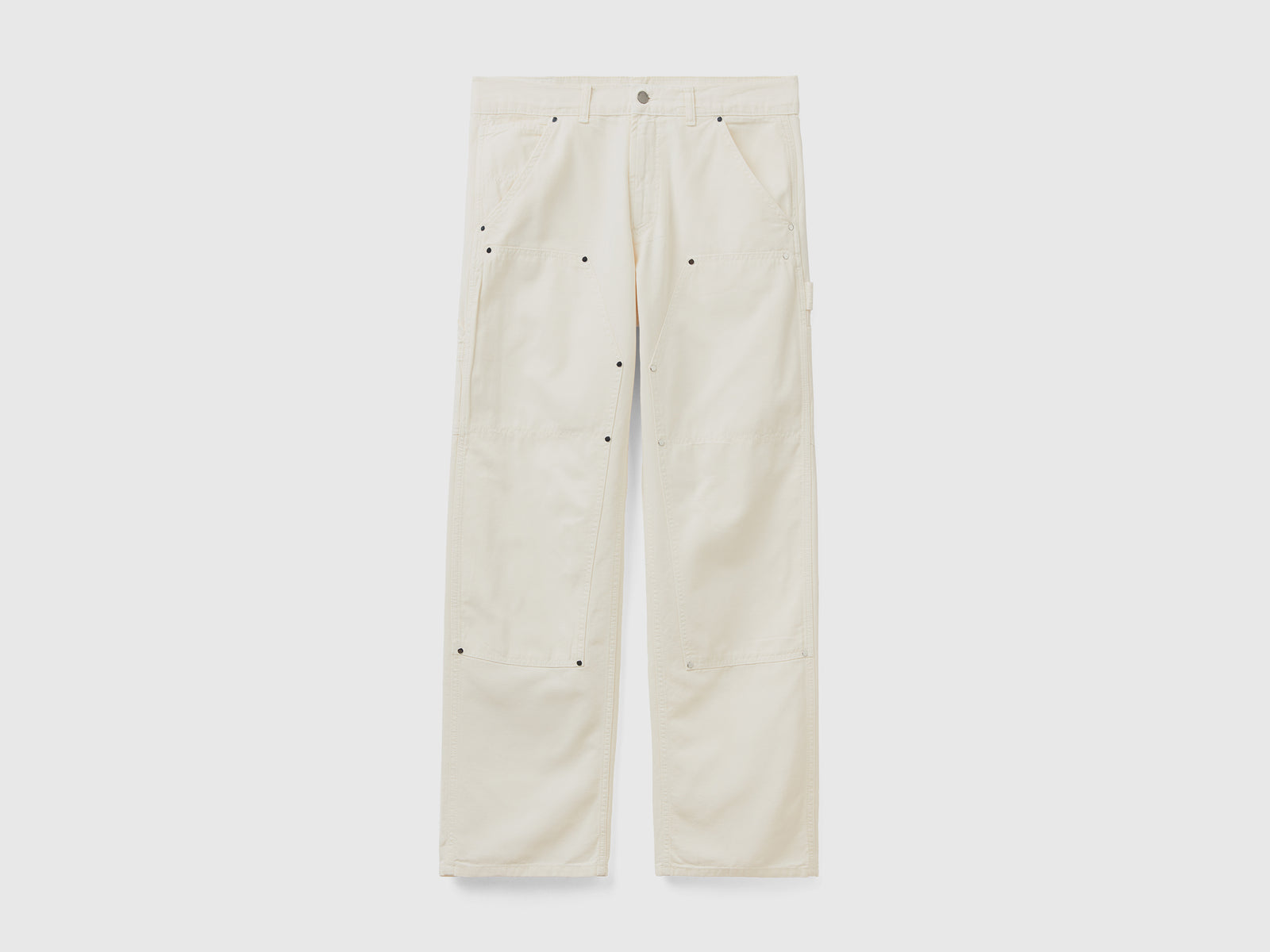 Pantaloni lunghi in puro cotone tinto in capo con impunture a contrasto da uomo bianco panna | Benetton Outlet