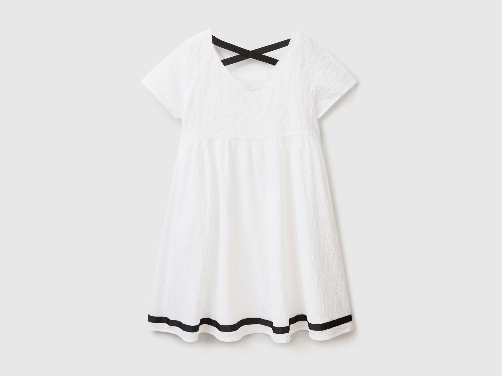 Abito svasato a manica corta in cotone elasticizzato dal peso medio da bambina bianco 2 | Benetton Outlet