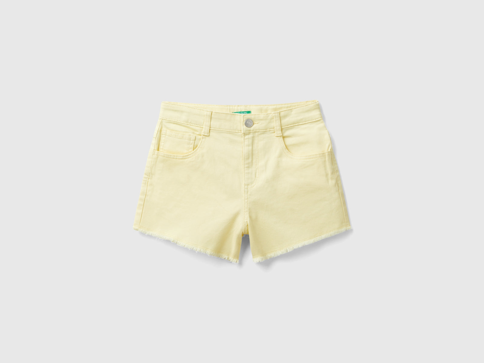 Shorts sfrangiati in cotone stretch da bambina giallo | Benetton Outlet