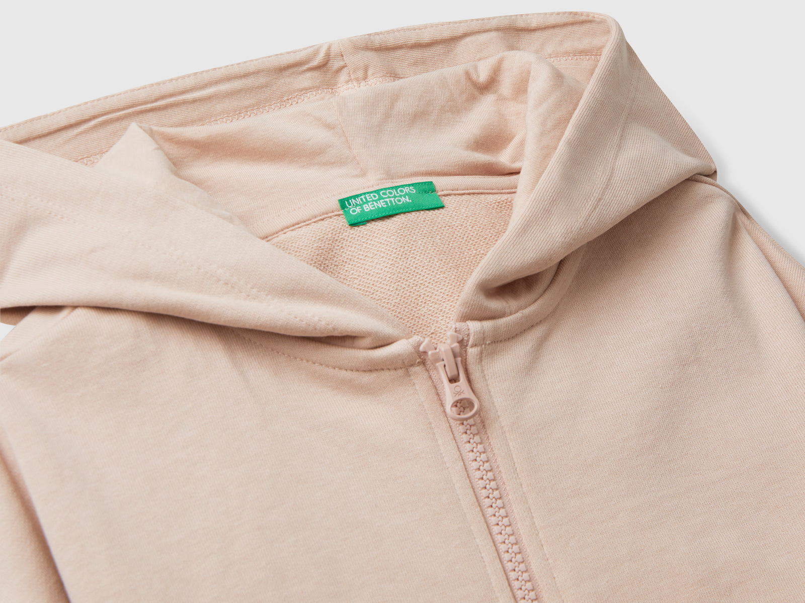 Felpa con zip e cappuccio da bambina rosa tenue 3 | Benetton Outlet
