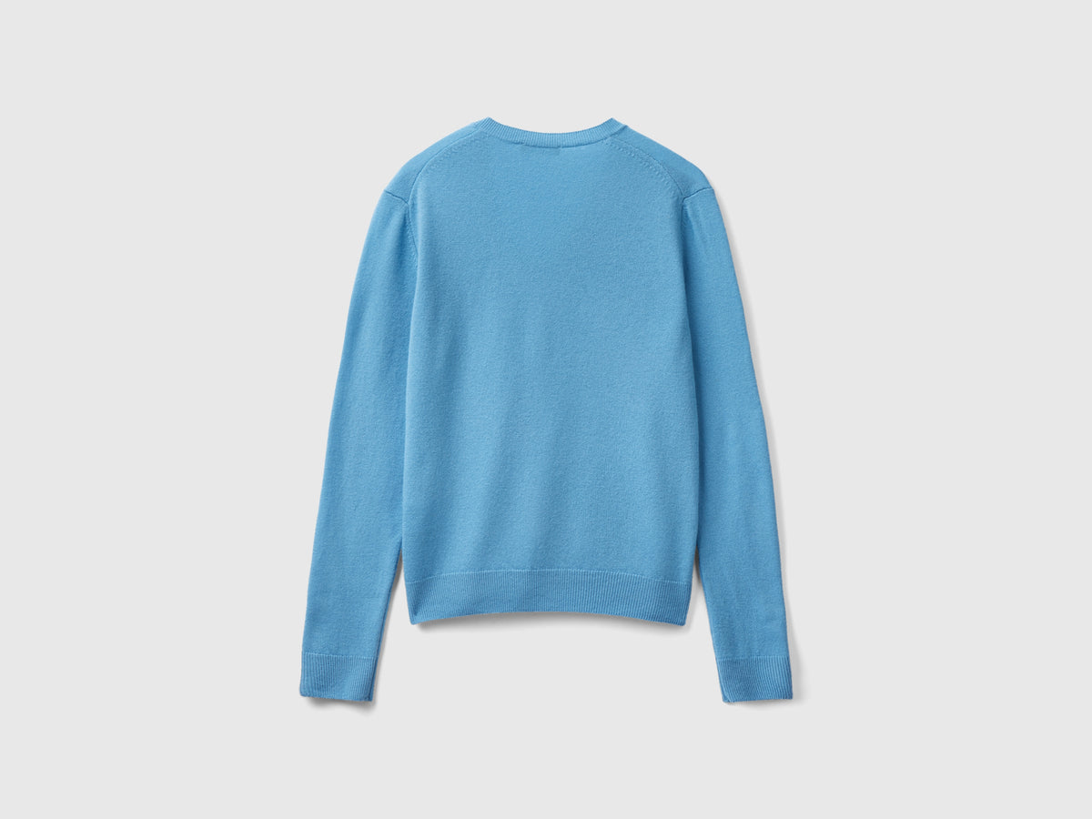 Maglia con scollo a V azzurra in pura lana Merino