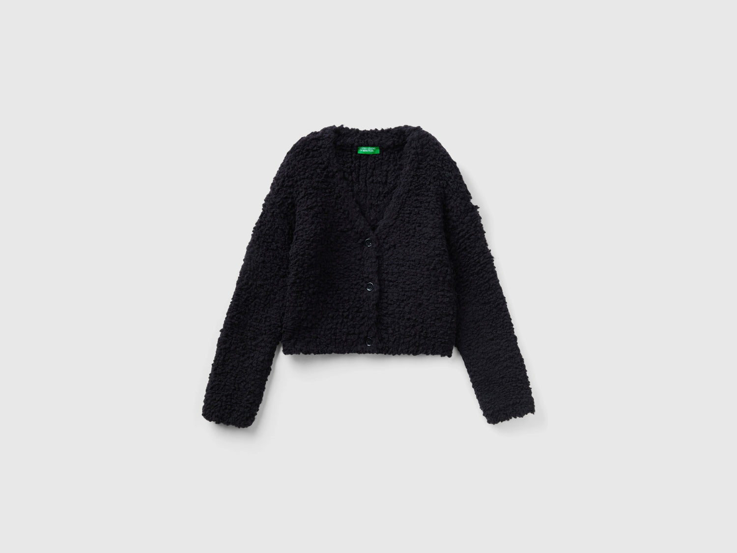 Cardigan bouclé con scollo a V da bambina nero | Benetton Outlet