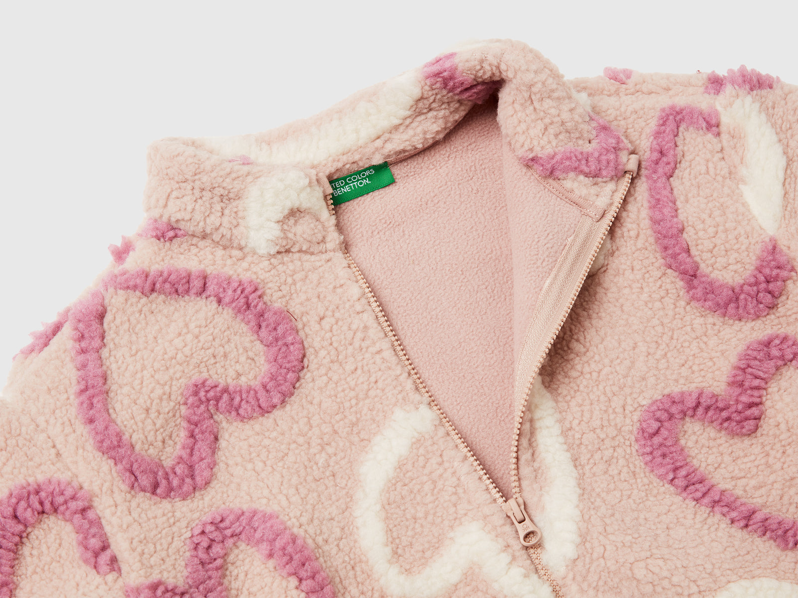 Felpa a cuori in pelliccetta sintetica da bimba rosa tenue 3 | Benetton Outlet