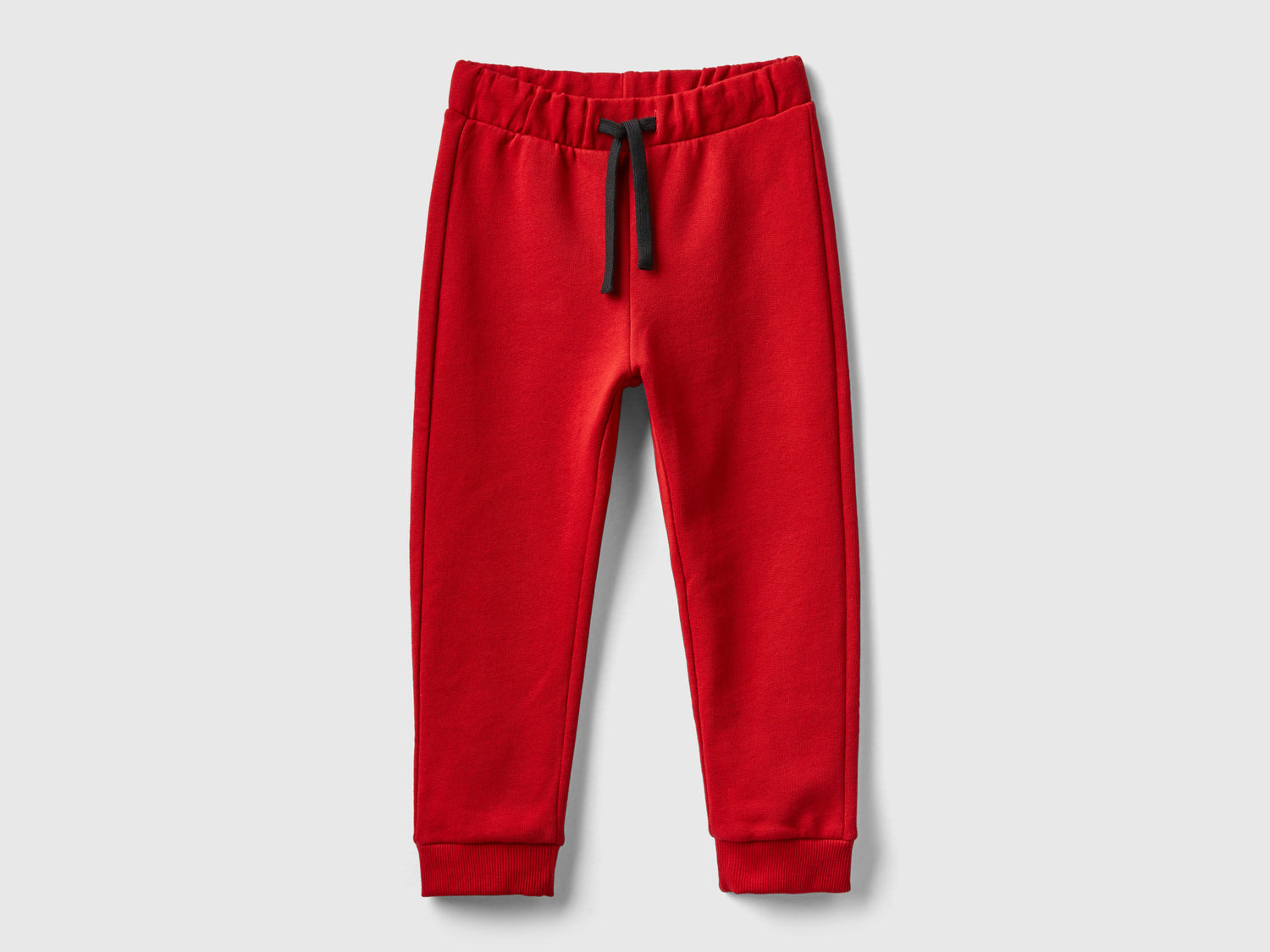 Pantaloni in felpa con taschino da bimbo rosso | Benetton Outlet
