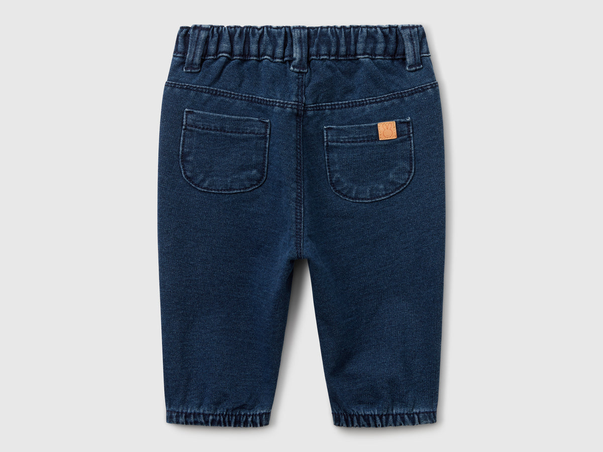 Pantaloni effetto denim con fiocchetto
