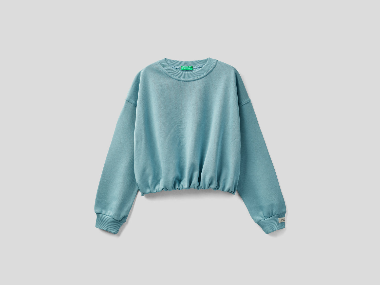 Felpa cropped in cotone da bambina azzurro | Benetton Outlet