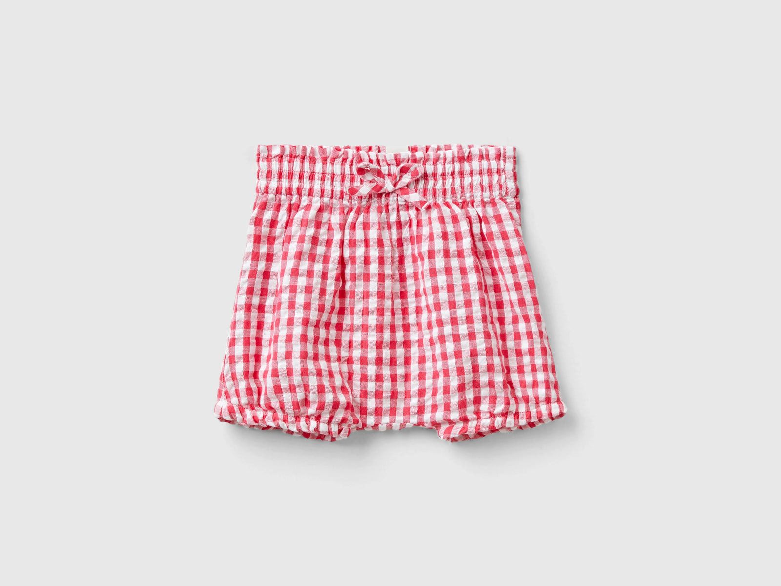 Pantaloni corti vichy da neonato fucsia | Benetton Outlet