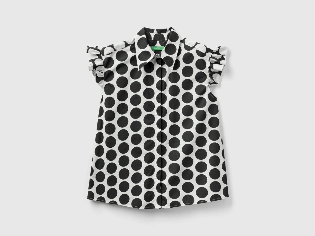 Camicia smanicata a pois