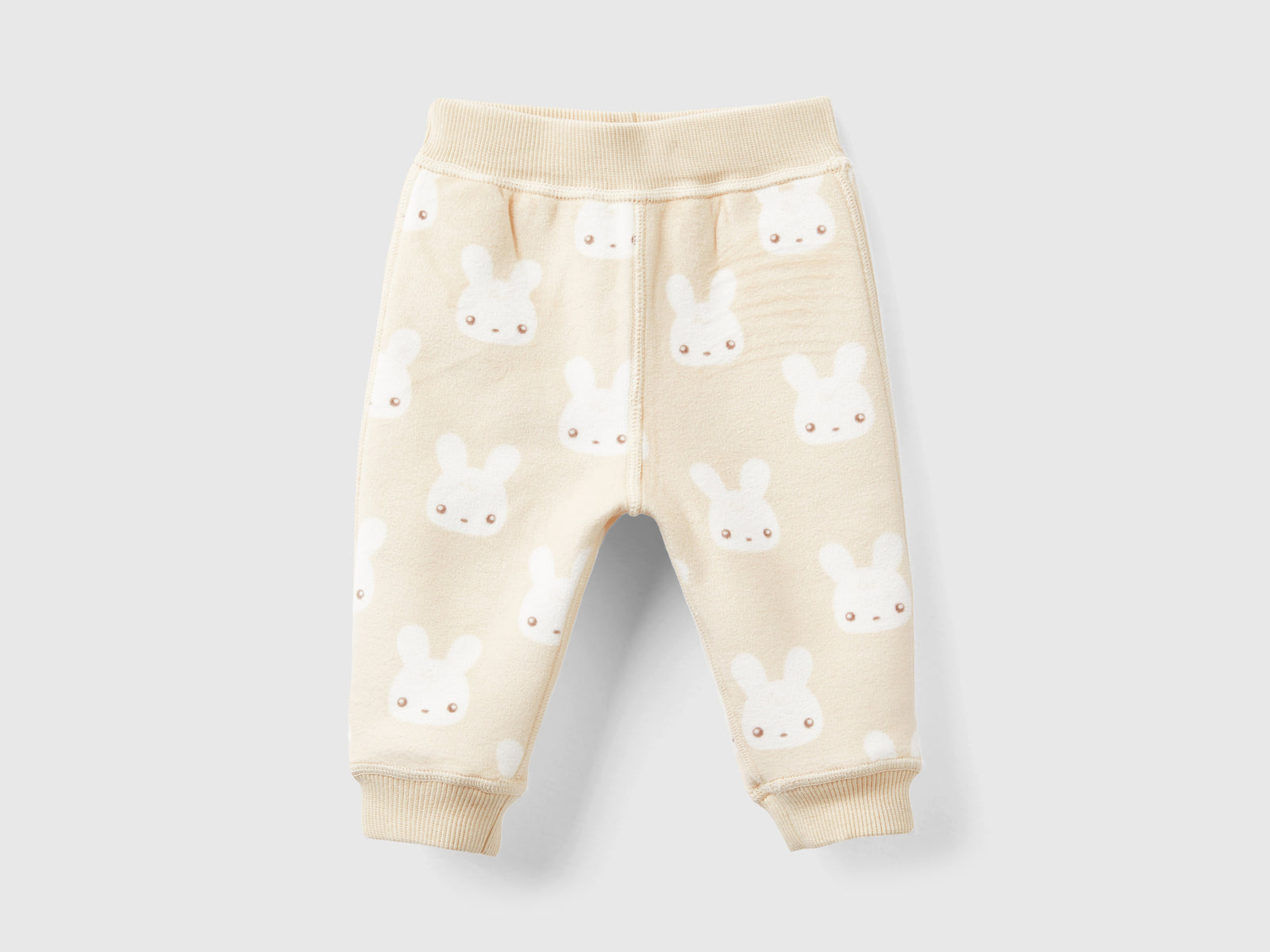Pantaloni reversibili con coniglietti da neonato beige 2 | Benetton Outlet