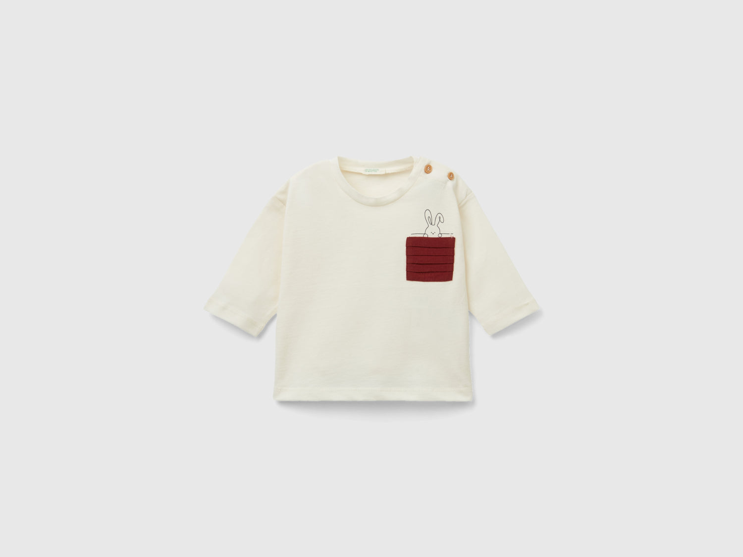 Maglietta con taschino plissettato da neonato bianco panna | Benetton Outlet