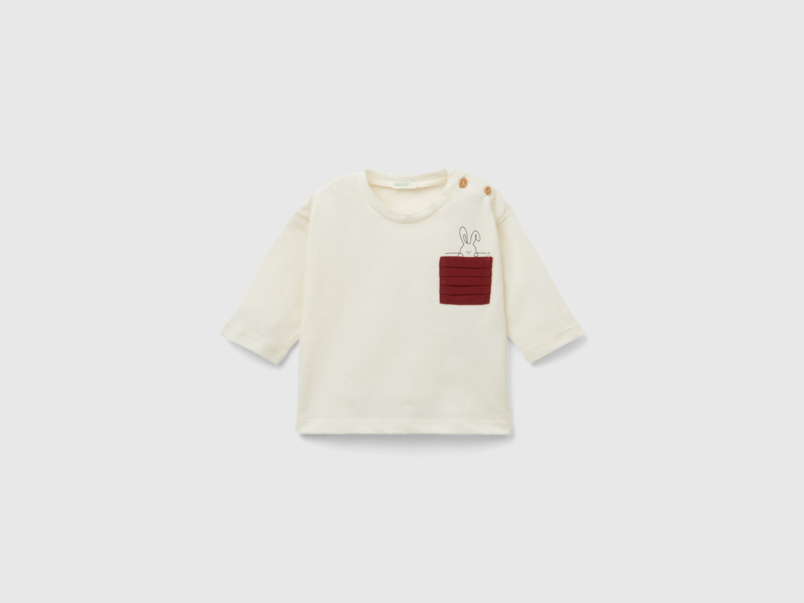 Maglietta con taschino plissettato da neonato bianco panna | Benetton Outlet