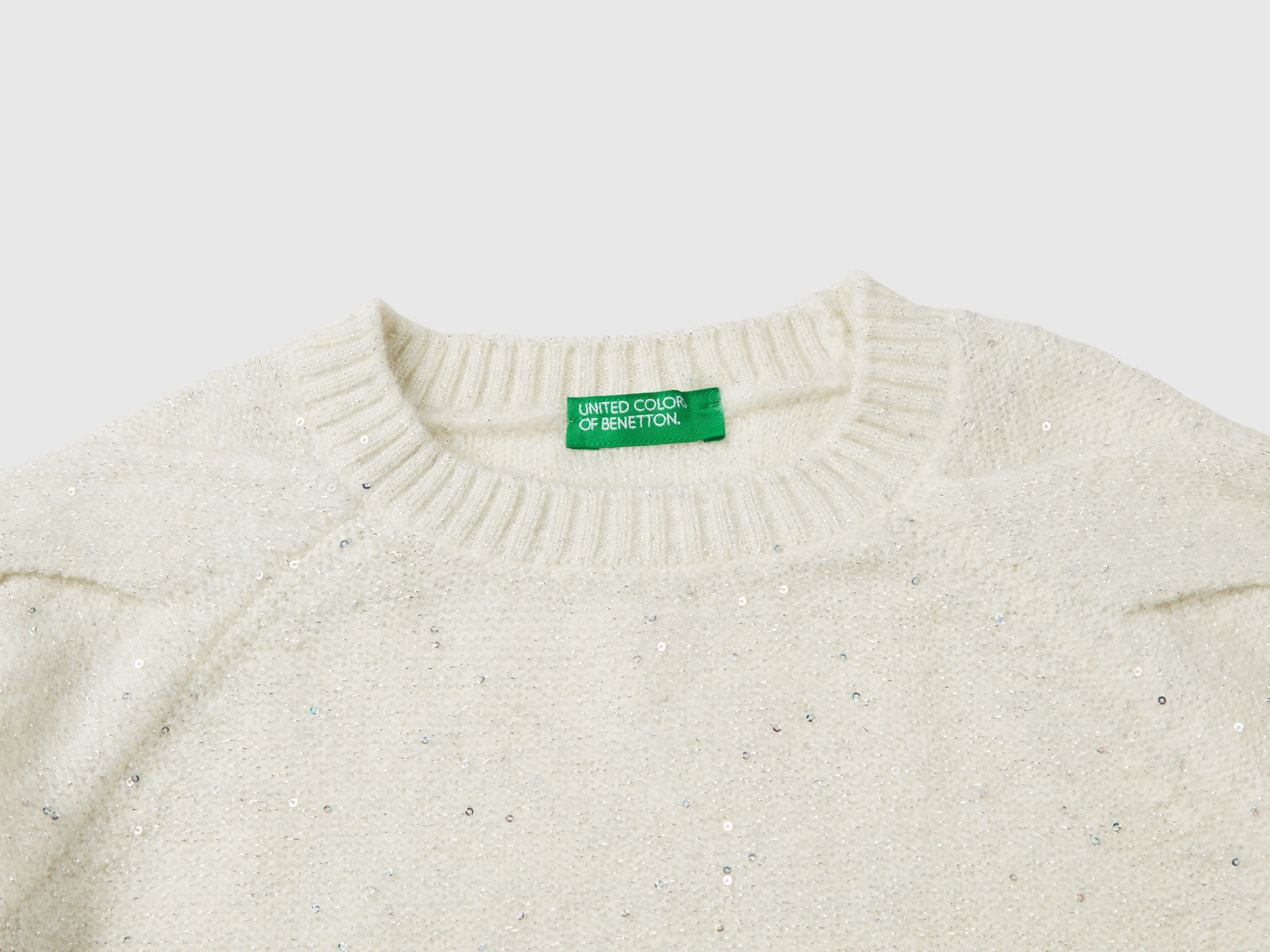 Maglia con tessuto riciclato e paillettes da bambina bianco panna 3 | Benetton Outlet