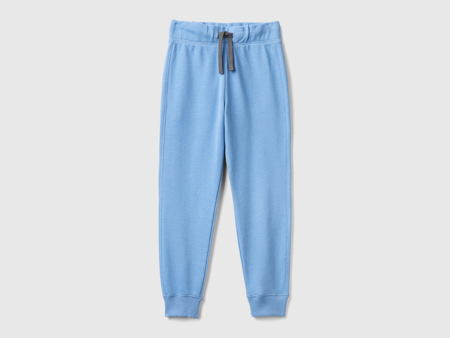 Pantaloni in felpa 100% cotone da bambino azzurro | Benetton Outlet