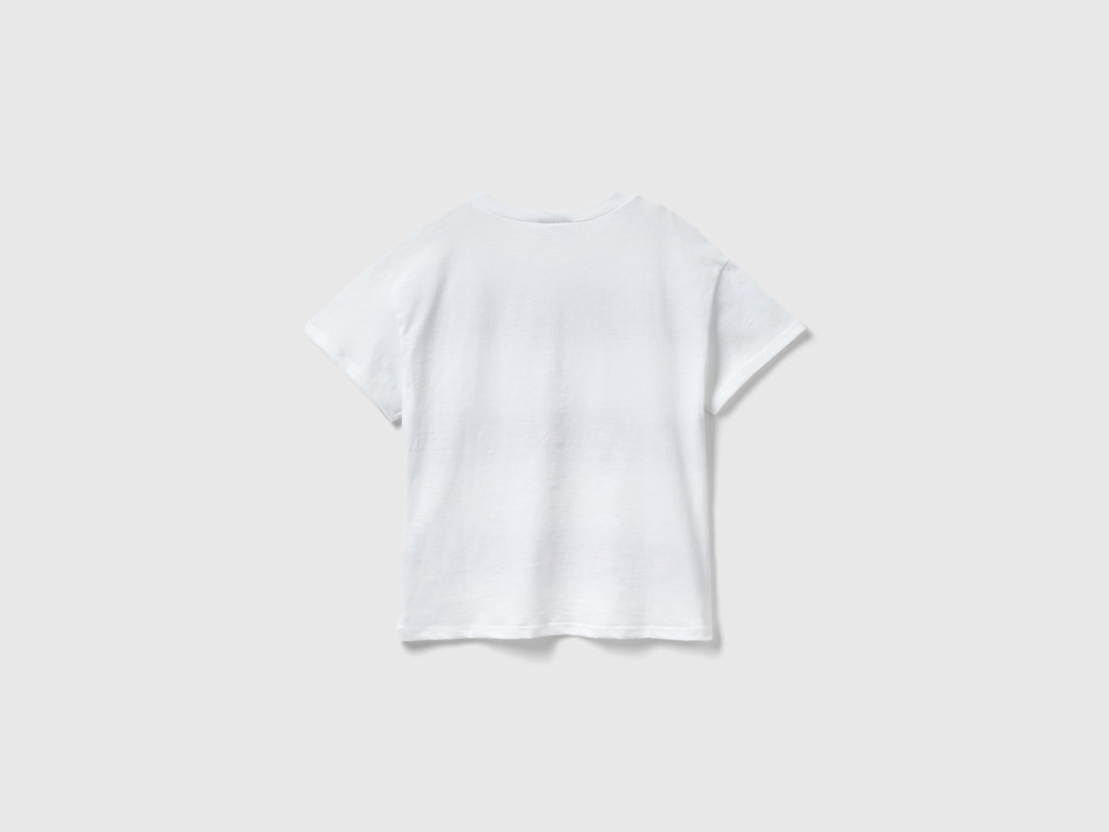 T-shirt manica corta con glitter da bambina bianco 2 | Benetton Outlet