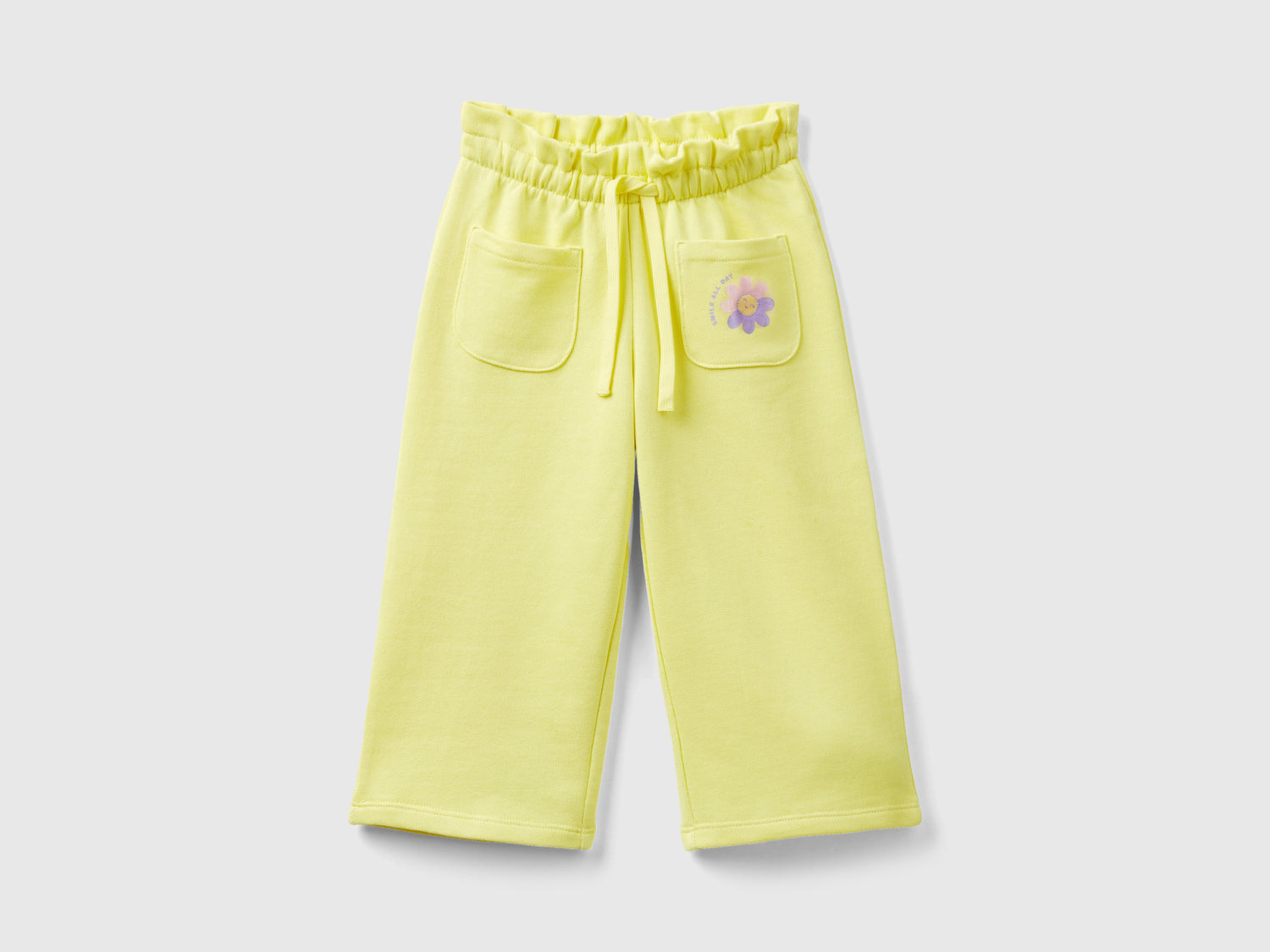 Pantaloni in felpa cropped da bimba giallo | Benetton Outlet