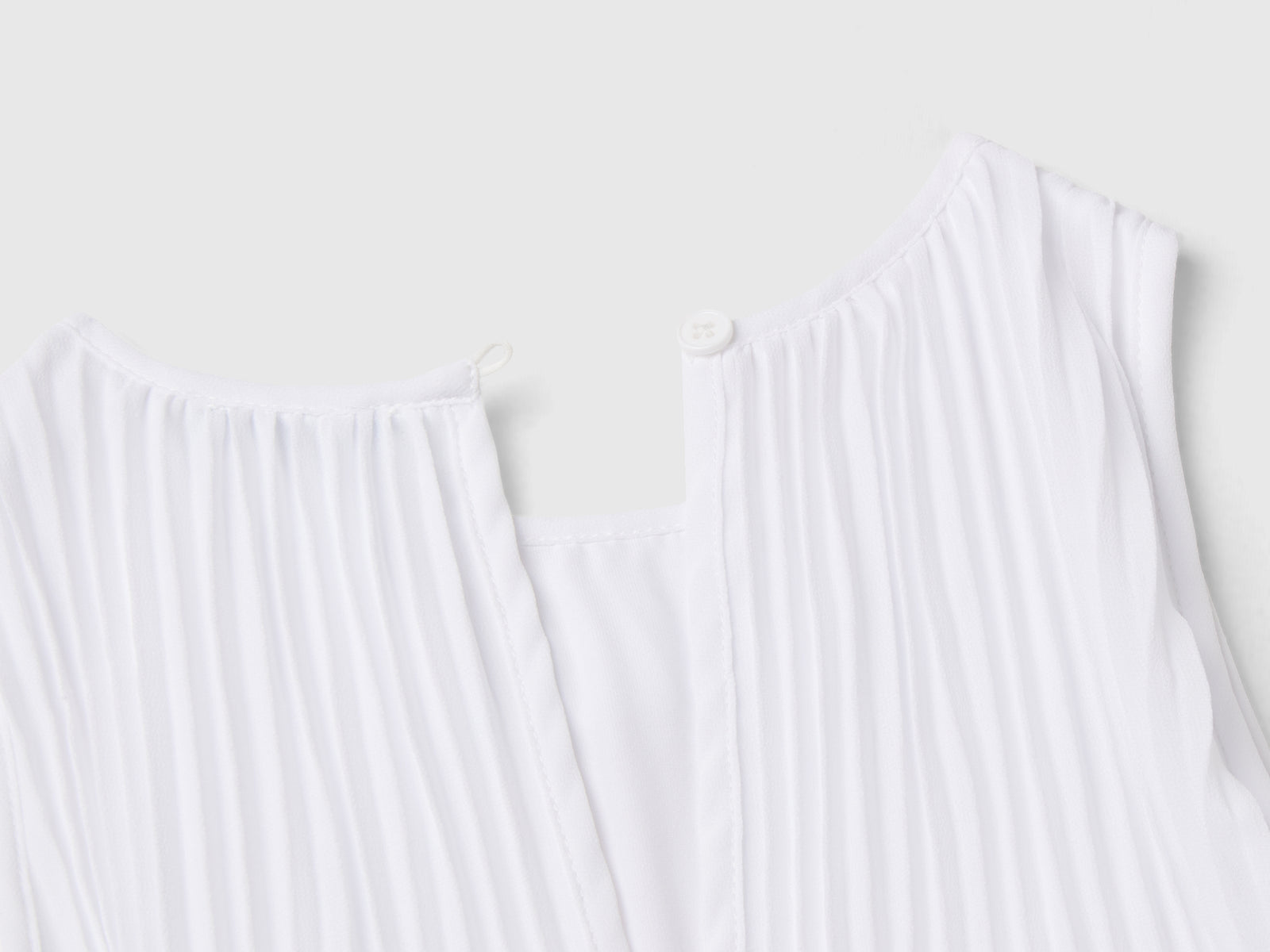 Tuta plissettata da bambina bianco 2 | Benetton Outlet