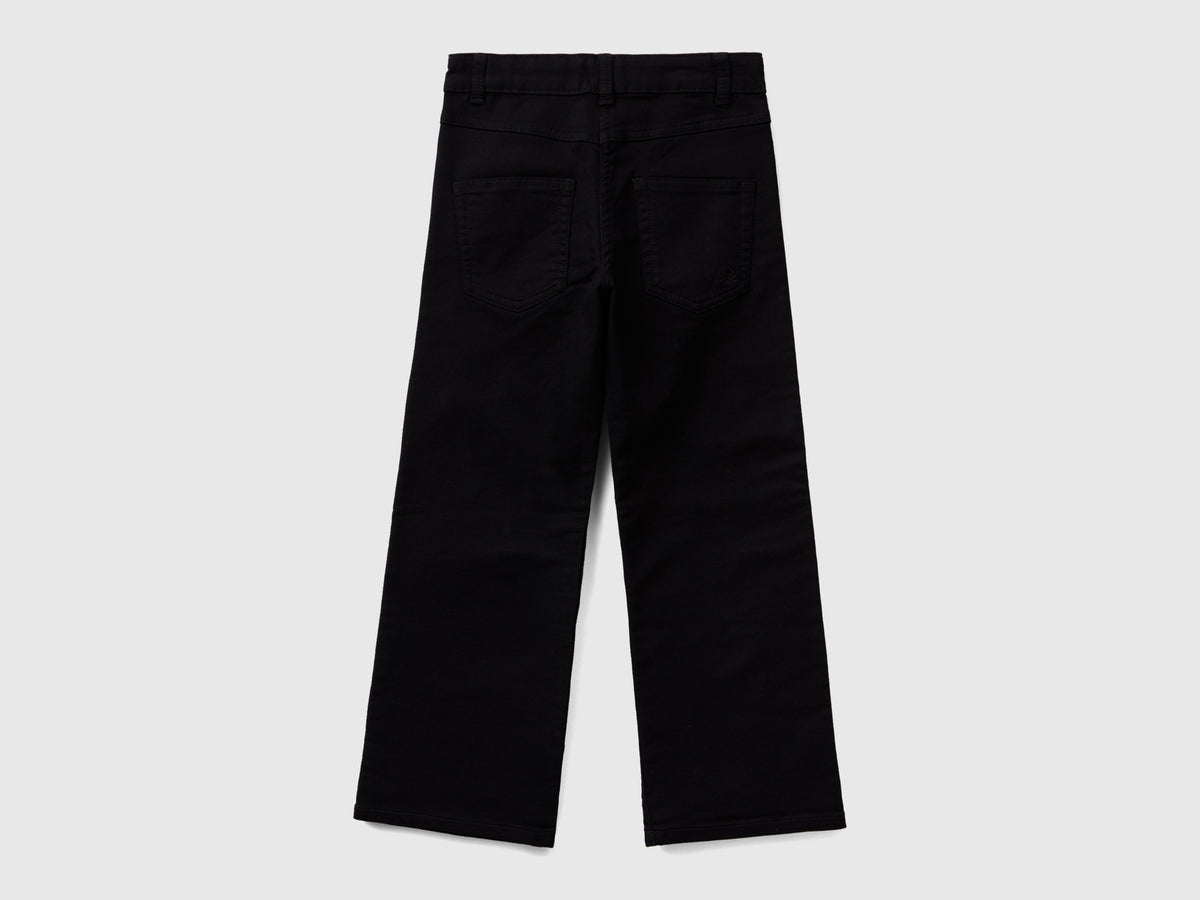 Pantaloni a zampa stretch