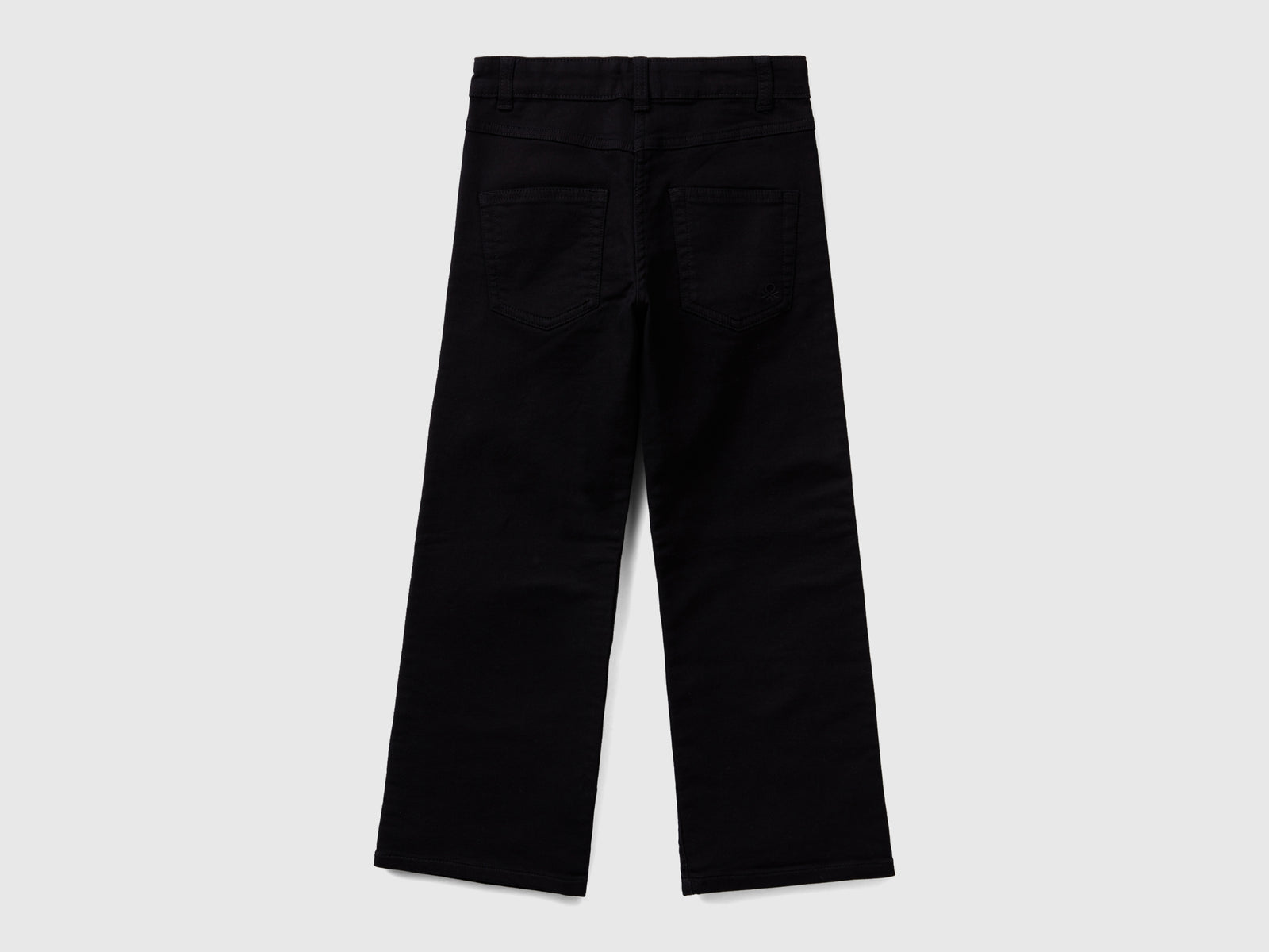 Pantaloni a zampa stretch da bambina nero 2 | Benetton Outlet