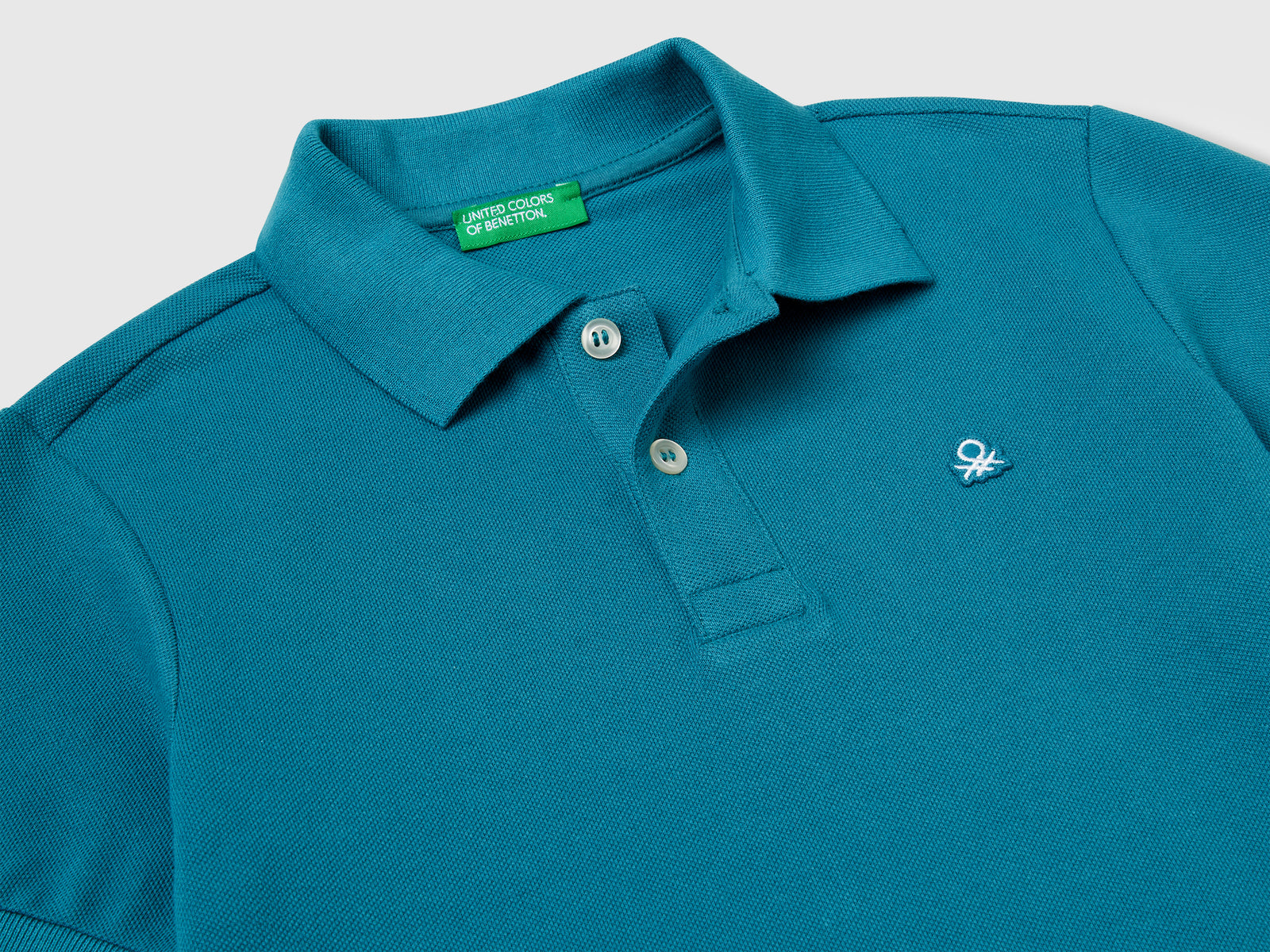 Polo slim fit in puro cotone da bambino verde ottanio 3 | Benetton Outlet