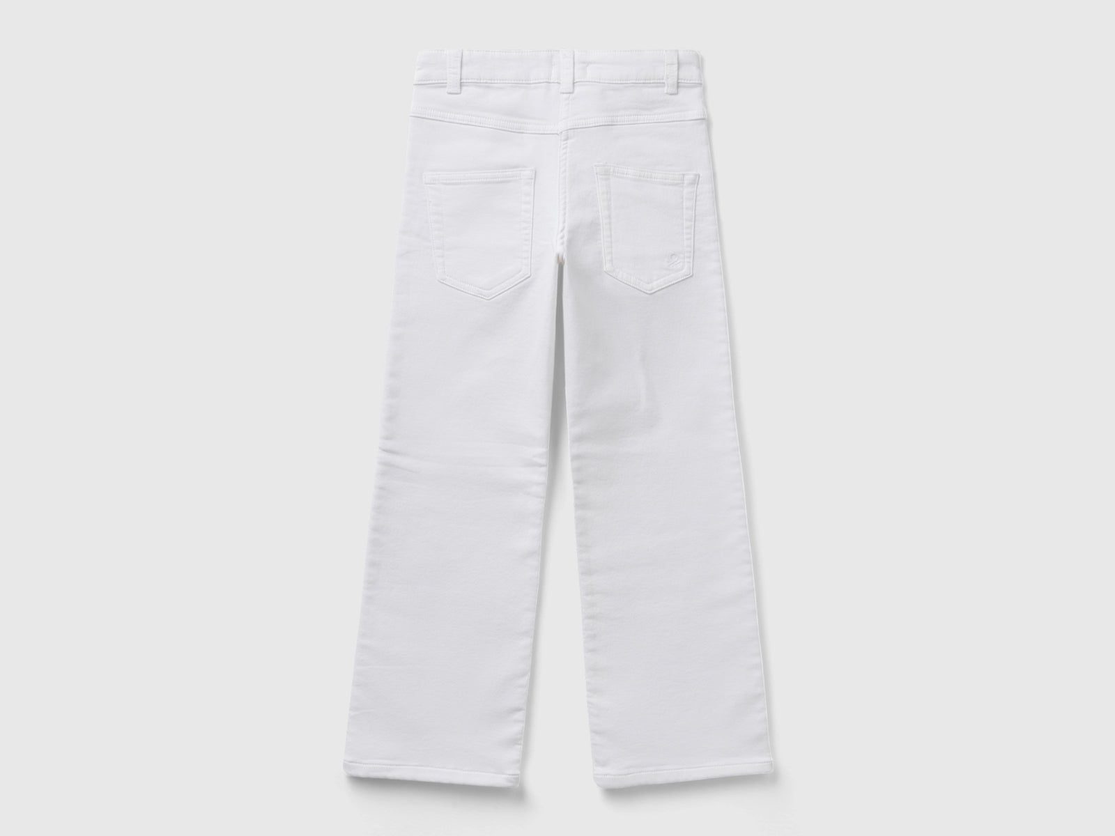 Pantaloni a zampa stretch da bambina bianco 2 | Benetton Outlet