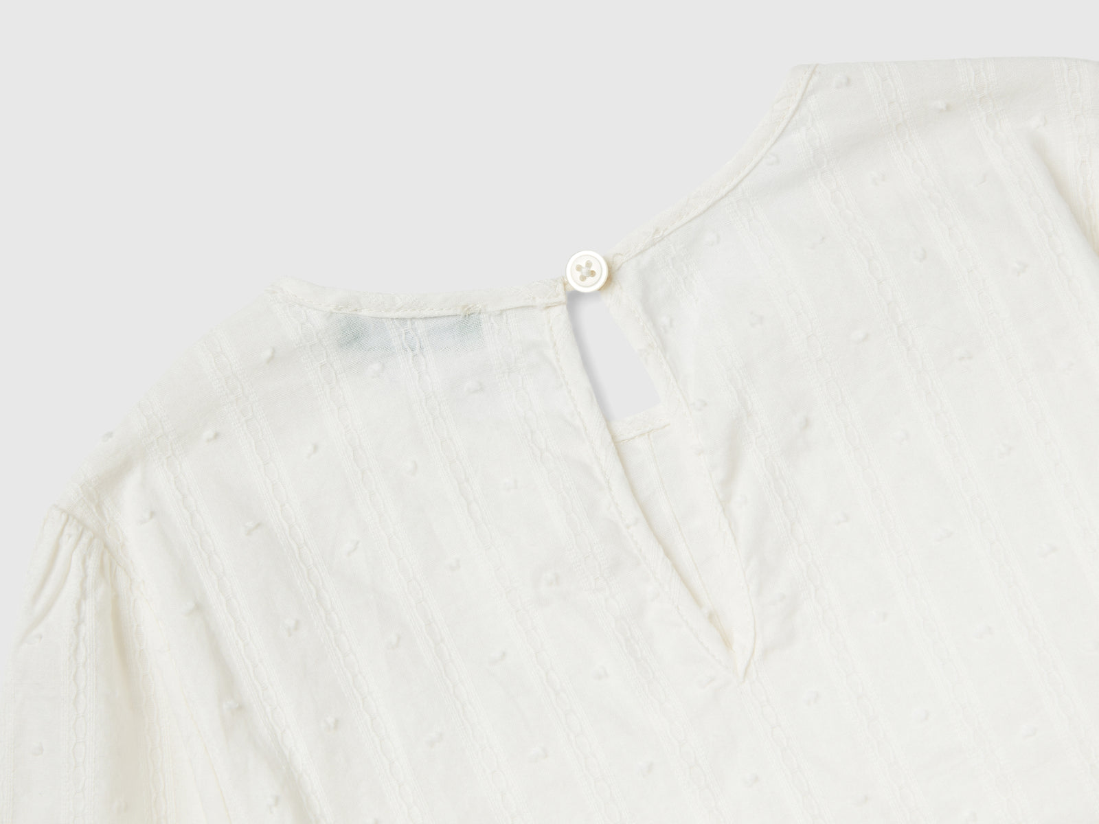 Blusa leggera in puro cotone da bambina bianco panna 2 | Benetton Outlet