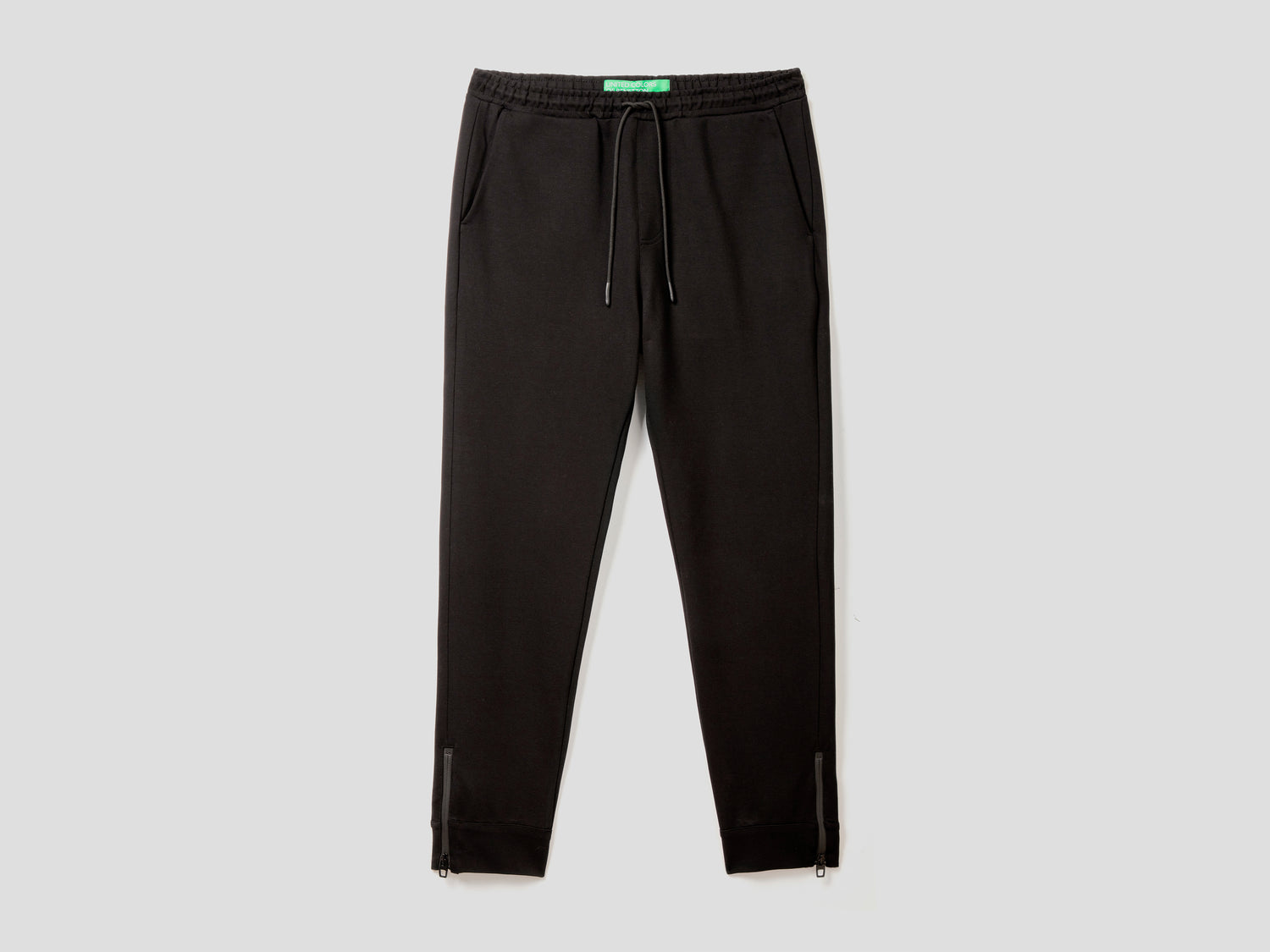 Pantaloni sportivi con zip laterali da uomo nero | Benetton Outlet