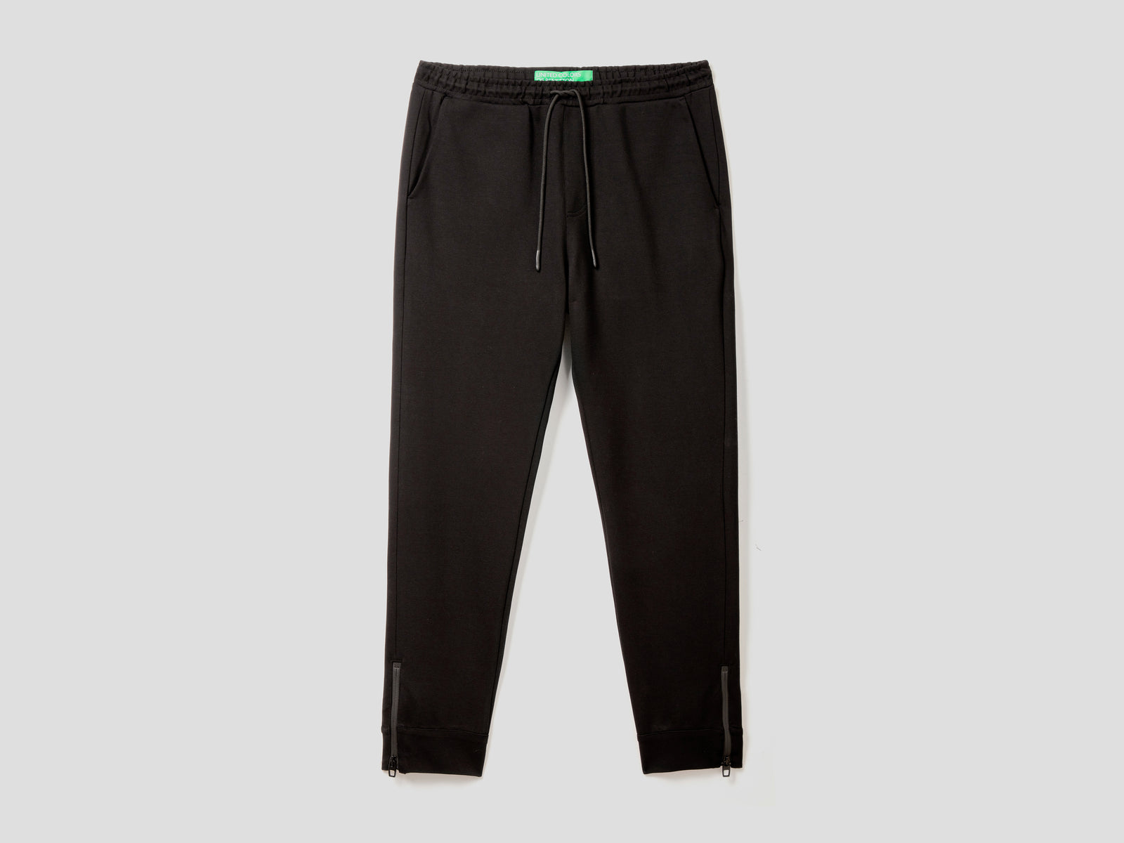 Pantaloni sportivi con zip laterali da uomo nero | Benetton Outlet