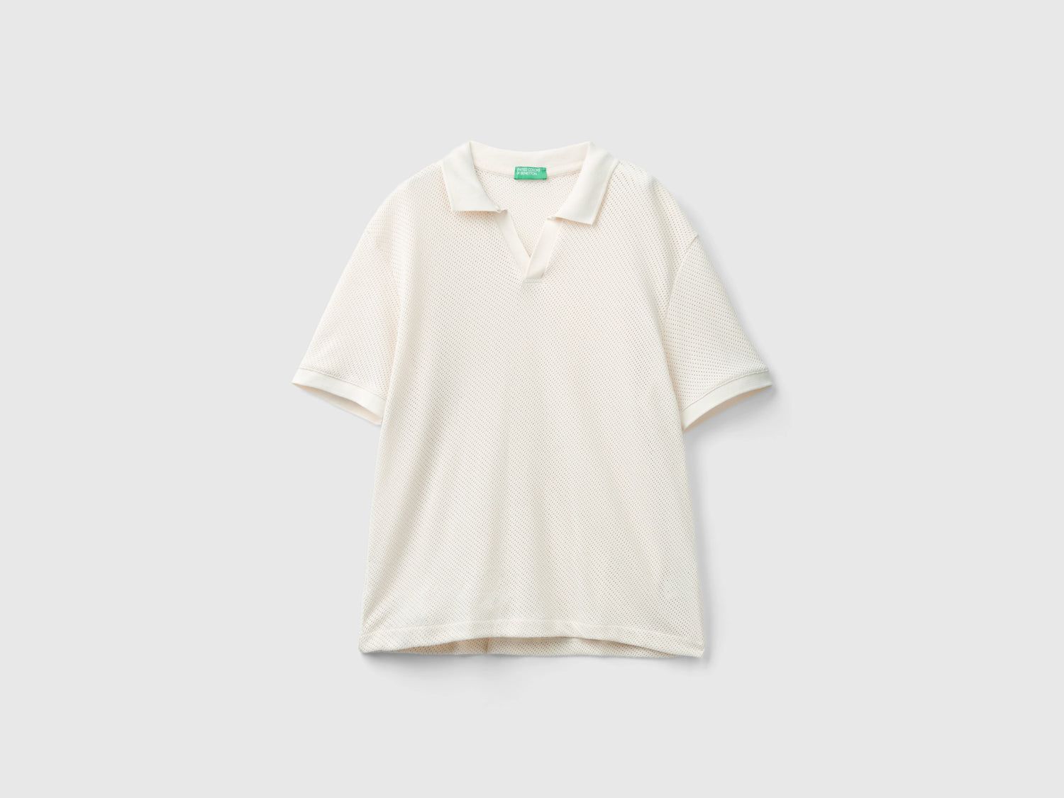 Polo in cotone traforato da uomo bianco panna | Benetton Outlet