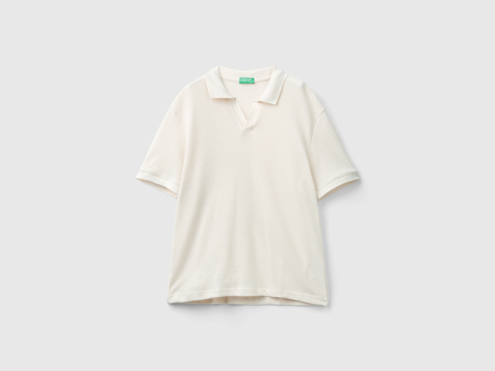Polo in cotone traforato da uomo bianco panna | Benetton Outlet