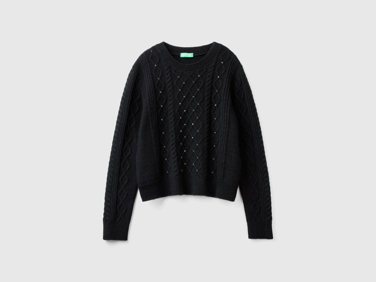 Sweater with braids and rhinestones