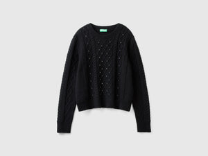 Sweater with braids and rhinestones