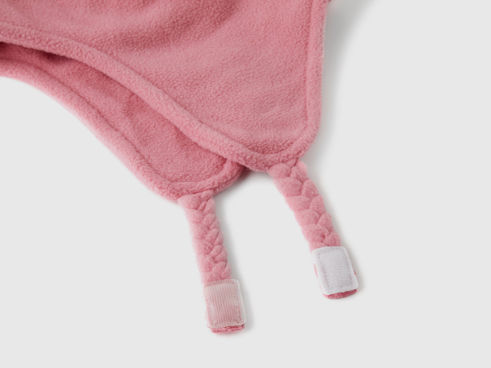 Cappello con paraorecchie e pom pom da bimbo fucsia 2 | Benetton Outlet
