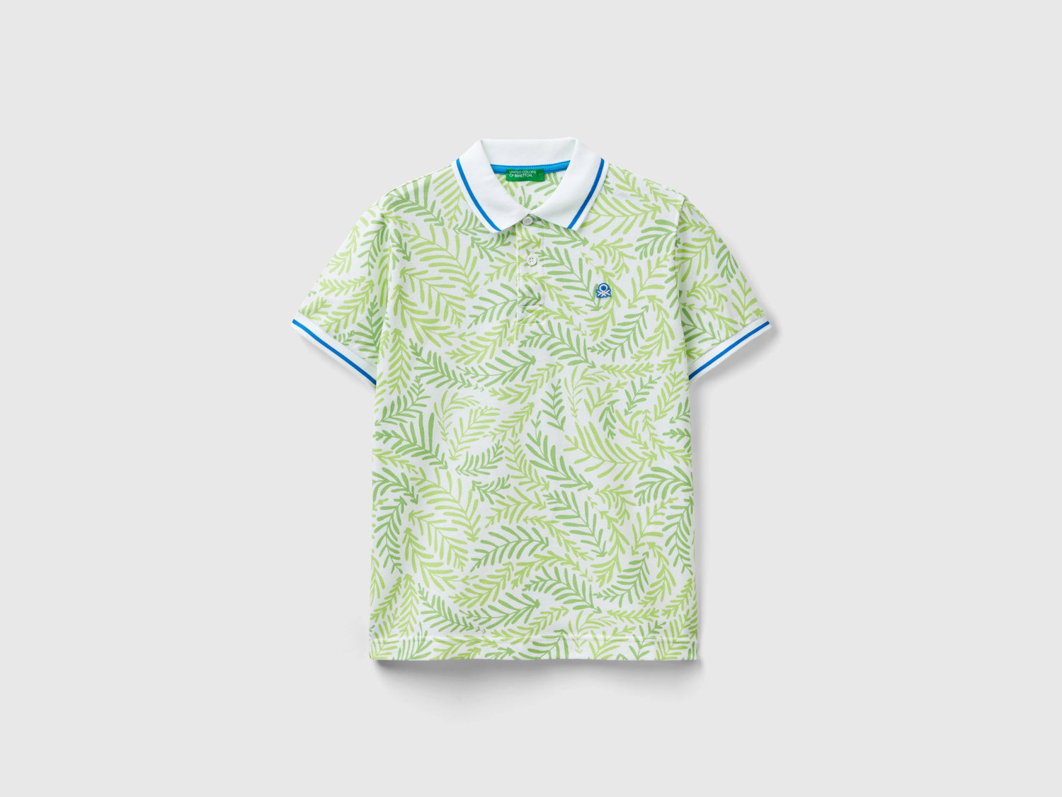 Polo con stampa tropicale da bambino bianco | Benetton Outlet