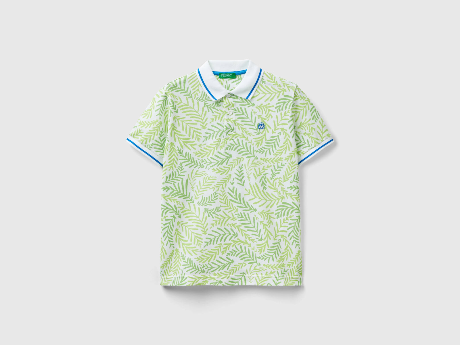 Polo con stampa tropicale da bambino bianco | Benetton Outlet