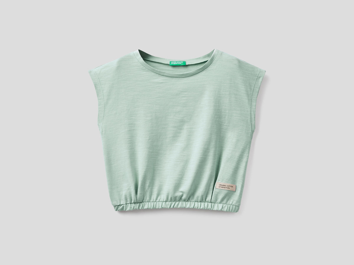 T-shirt cropped in puro cotone da bambina verde chiaro | Benetton Outlet