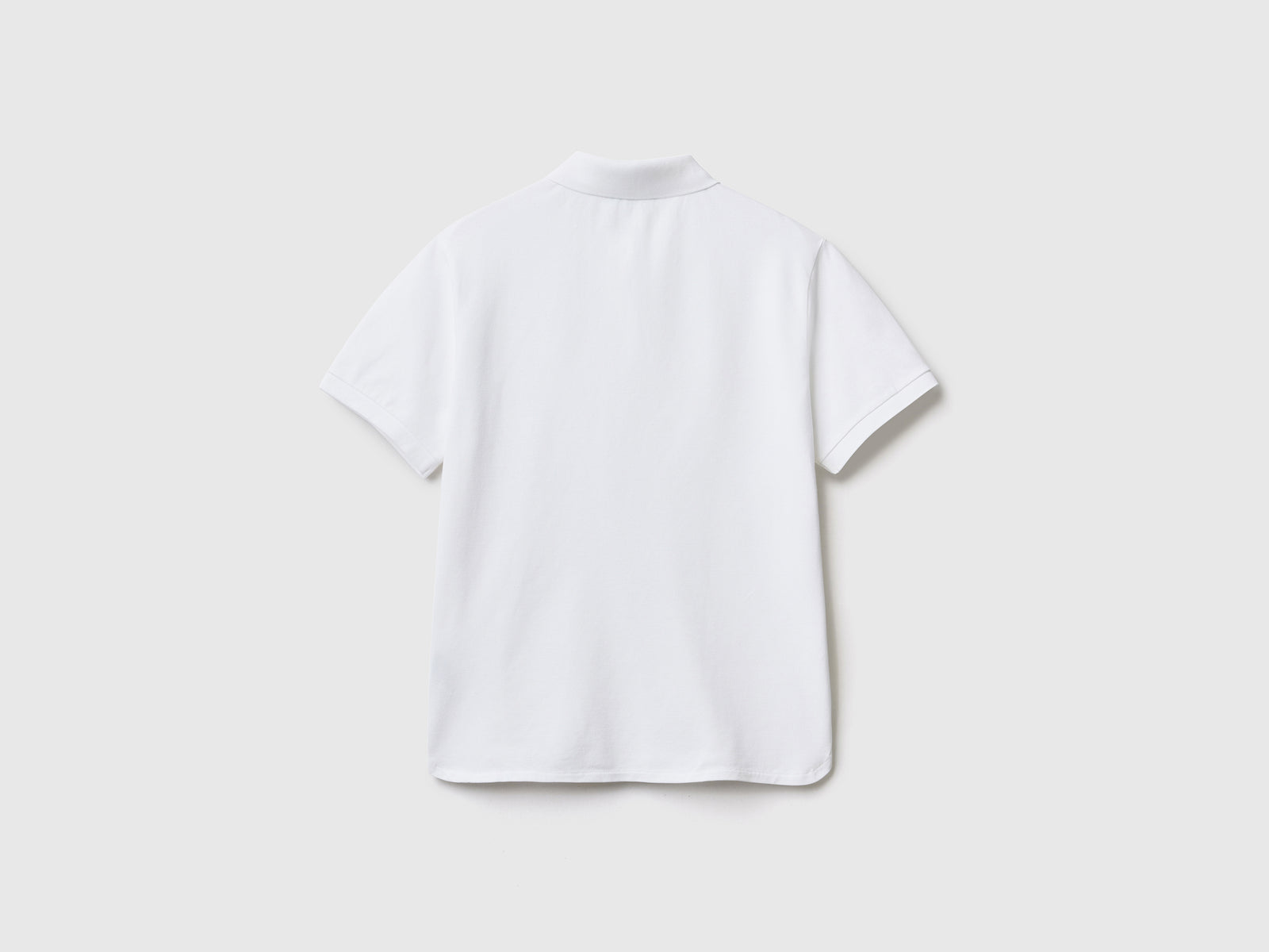 Polo a manica corta in piquet di cotone elasticizzato da donna bianco 2 | Benetton Outlet