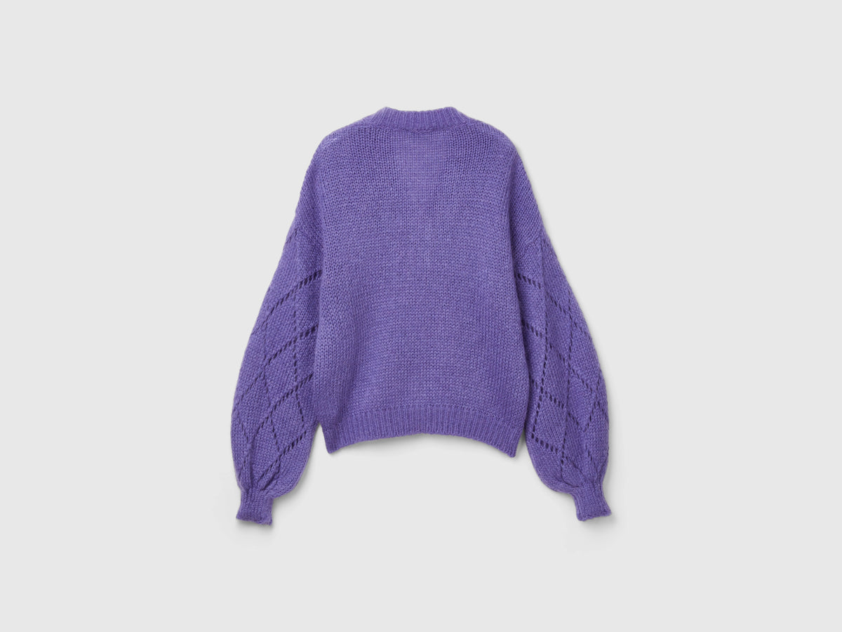 Maglione con manica traforata