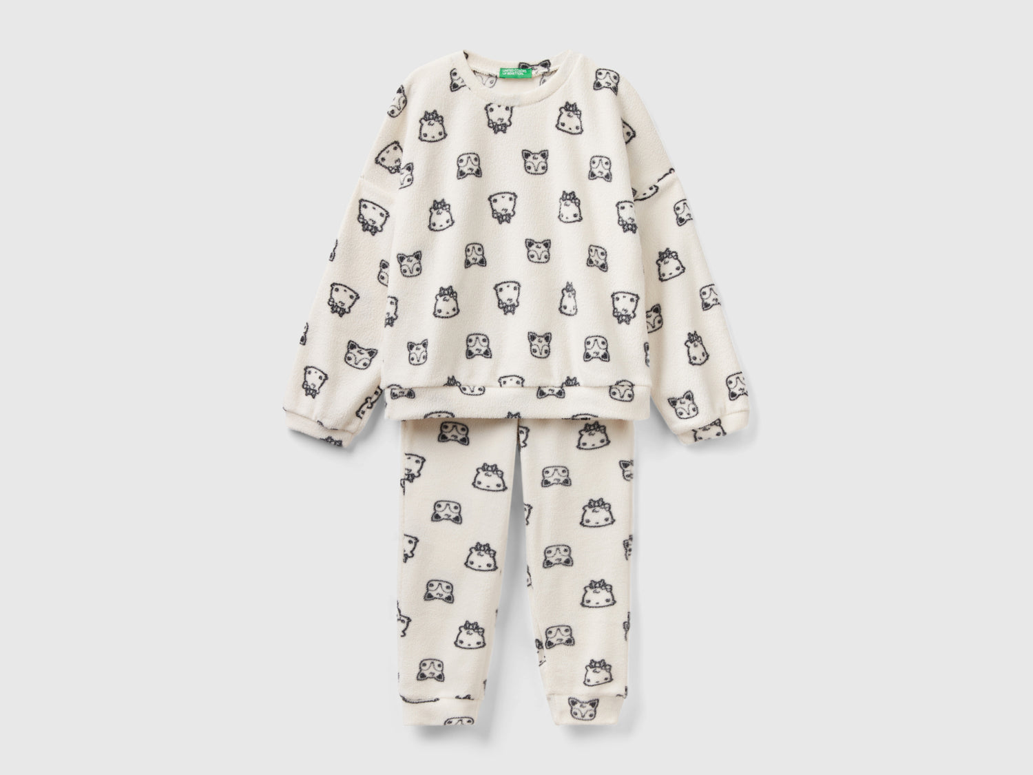 Pigiama in pile con stampa mascotte da bambina bianco panna | Benetton Outlet