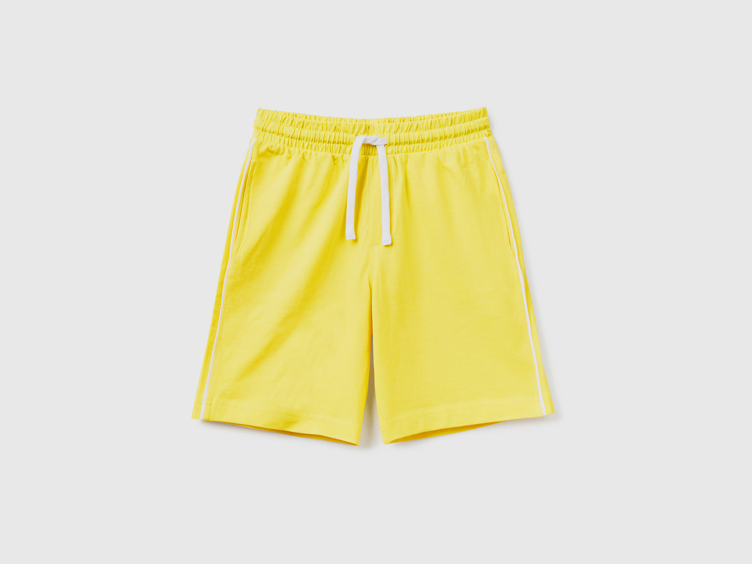 Pantaloni corti in puro cotone da bambino giallo | Benetton Outlet