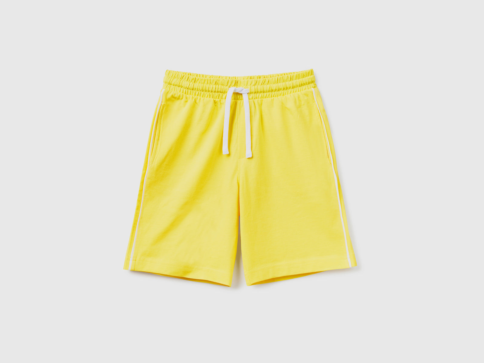 Pantaloni corti in puro cotone da bambino giallo | Benetton Outlet