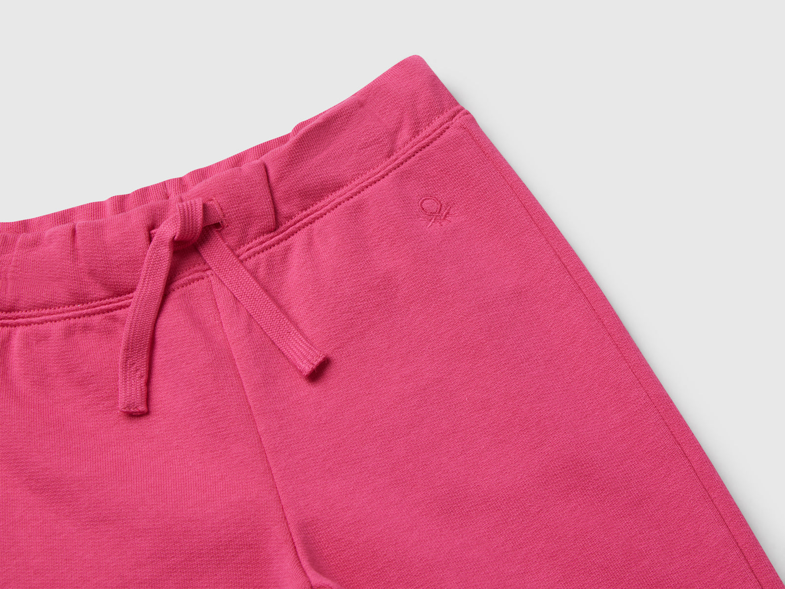 Pantaloni in felpa di cotone da bimba fucsia 3 | Benetton Outlet