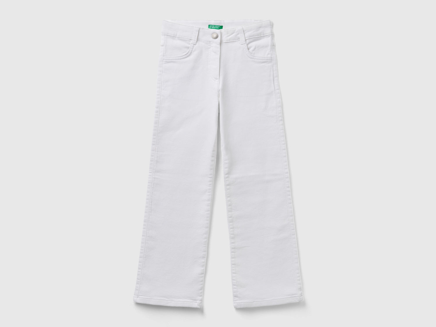 Pantaloni a zampa stretch da bambina bianco | Benetton Outlet
